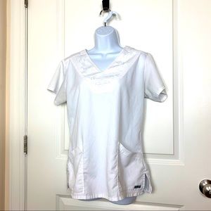Grey’s Anatomy white scrub top. Patterned neckline. Medium